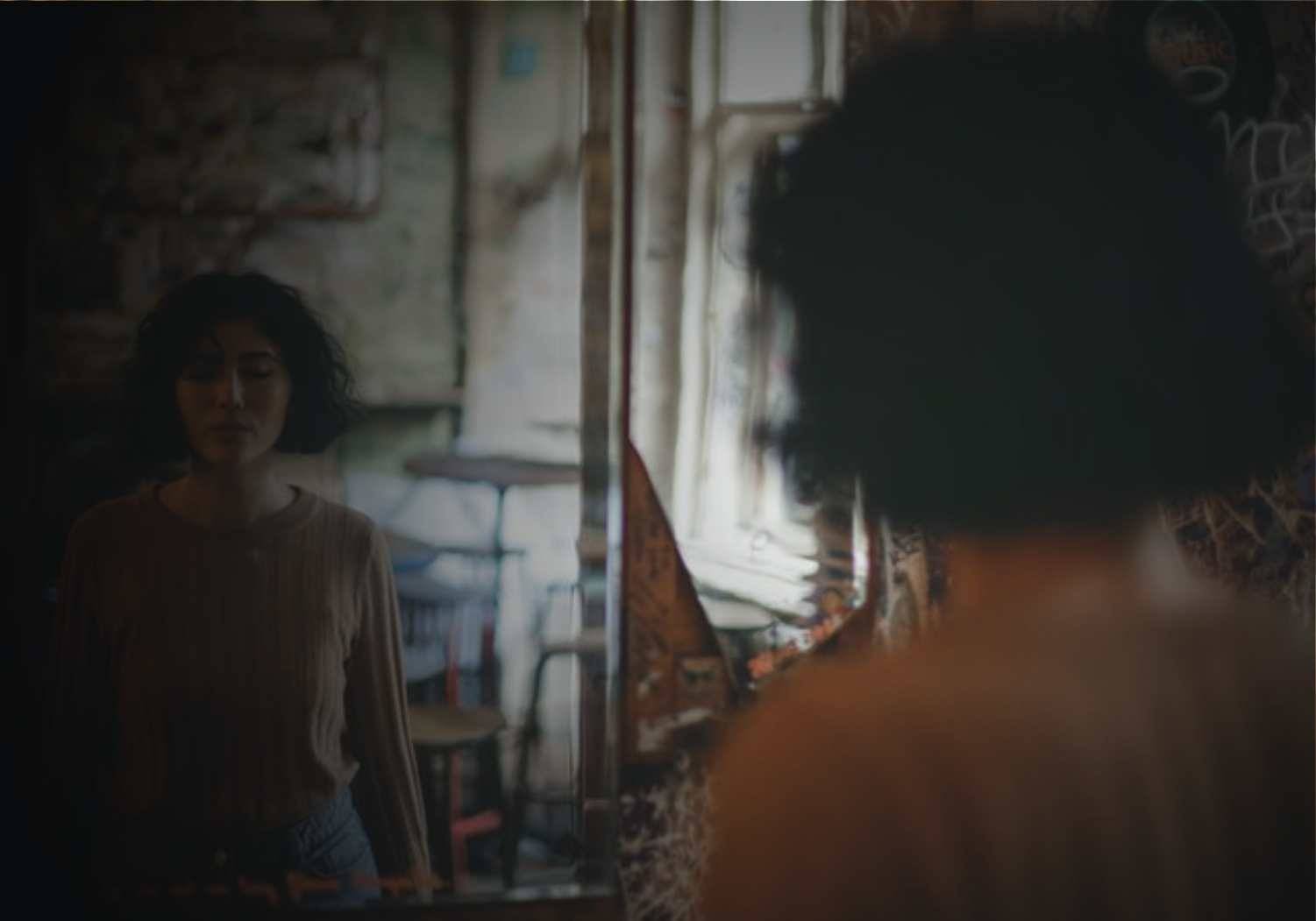 woman-standing-in-front-of-a-mirror-3915673_2